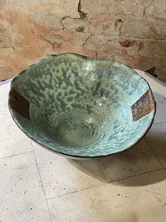 Green bowl with brown accents