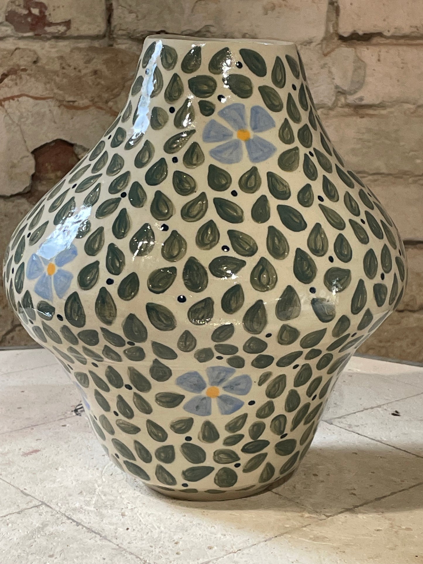 Leaf explosion with blue flowers