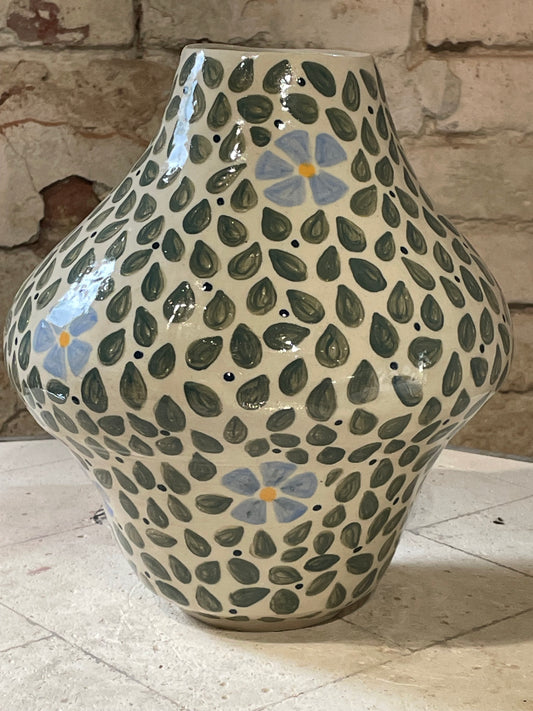 Leaf explosion with blue flowers